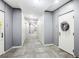 Hallway of condo with doors, grey walls, carpet, and overhead lighting at 111 N 12Th St # 1819, Tampa, FL 33602