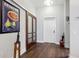 Hallway with hardwood floors, stylish art, and doors leading to other rooms at 111 N 12Th St # 1819, Tampa, FL 33602