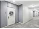 Hallway of condo with doors, grey walls, carpet, and overhead lighting at 111 N 12Th St # 1819, Tampa, FL 33602
