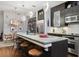 Bright kitchen with stainless steel appliances, seating, and a view of the dining area at 111 N 12Th St # 1819, Tampa, FL 33602