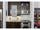 Stylish kitchen featuring stainless steel appliances and dark wood cabinetry at 111 N 12Th St # 1819, Tampa, FL 33602