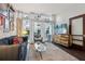Living room of condo with sofa, armchair, glass coffee table, and TV stand at 111 N 12Th St # 1819, Tampa, FL 33602