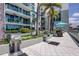 Upscale condo amenities include outdoor grill and dining area surrounded by tropical landscaping and modern balconies at 111 N 12Th St # 1819, Tampa, FL 33602