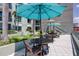 Upscale condo amenities include tables and chairs under large umbrellas in an outside common area at 111 N 12Th St # 1819, Tampa, FL 33602