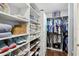 Organized walk-in closet with custom shelving for shoes, clothes, and accessories at 111 N 12Th St # 1819, Tampa, FL 33602