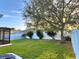 Spacious backyard with green grass and a white privacy fence at 11566 Balintore Dr, Riverview, FL 33579