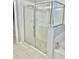 Bathroom with glass enclosed shower and soaking tub at 11566 Balintore Dr, Riverview, FL 33579