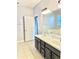 Bathroom featuring dual sink vanity and large mirror at 11566 Balintore Dr, Riverview, FL 33579