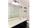 Bathroom with a large mirror over vanity and a combo bathtub and shower with storage shelves at 11566 Balintore Dr, Riverview, FL 33579