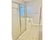 Bathroom featuring a glass shower and separate soaking tub at 11566 Balintore Dr, Riverview, FL 33579