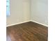 Bedroom showcasing hardwood floors, a window with blinds and fresh light paint at 11566 Balintore Dr, Riverview, FL 33579