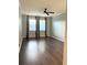 Spacious bedroom features hardwood floors, ceiling fan, and large windows at 11566 Balintore Dr, Riverview, FL 33579