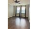Bedroom features hardwood floors, ceiling fan, and natural light at 11566 Balintore Dr, Riverview, FL 33579