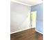 Bedroom showcasing hardwood floors, fresh paint, and a closet door at 11566 Balintore Dr, Riverview, FL 33579