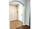 Bright entryway featuring an arched doorway, tiled floors, and coat rack at 11566 Balintore Dr, Riverview, FL 33579