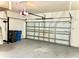 Spacious two-car garage featuring an automatic door and ample storage space at 11566 Balintore Dr, Riverview, FL 33579