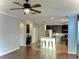 Open floor plan featuring modern kitchen with stainless steel appliances and breakfast bar seating at 11566 Balintore Dr, Riverview, FL 33579
