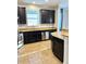 Kitchen featuring granite countertops, dark cabinets, and stainless steel appliances at 11566 Balintore Dr, Riverview, FL 33579
