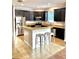 Kitchen with granite countertop island, stainless steel appliances, and dark cabinetry at 11566 Balintore Dr, Riverview, FL 33579
