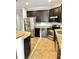 Well-lit kitchen features stainless steel appliances, granite countertops, and dark wood cabinets at 11566 Balintore Dr, Riverview, FL 33579