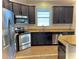 Updated kitchen with stainless steel appliances and granite countertops at 11566 Balintore Dr, Riverview, FL 33579
