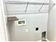 A laundry room featuring a storage shelf, wire rack and tiled floors at 11566 Balintore Dr, Riverview, FL 33579