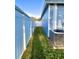 Cozy side yard with lush green grass and white privacy fence at 11566 Balintore Dr, Riverview, FL 33579