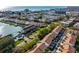 Community aerial view featuring a pool, marina, and lush landscaping in a desirable coastal location at 12308 Sun Vista W Ct # 45, Treasure Island, FL 33706