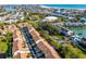Community aerial view showcasing the well-maintained landscaping, ample parking, and proximity to the beach at 12308 Sun Vista W Ct # 45, Treasure Island, FL 33706
