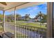 Screened-in balcony with street views and lush landscaping at 12308 Sun Vista W Ct # 45, Treasure Island, FL 33706