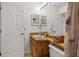 Bathroom featuring a toilet, wood vanity, and walk in shower/tub combination at 12308 Sun Vista W Ct # 45, Treasure Island, FL 33706
