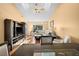 Open-concept living room featuring a ceiling fan, wood floors, and large windows at 12308 Sun Vista W Ct # 45, Treasure Island, FL 33706