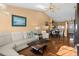 Open-concept living area with dining space, hardwood floors, and a bright interior at 12308 Sun Vista W Ct # 45, Treasure Island, FL 33706