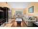 Comfortable living area with hardwood floors and a large sofa at 12308 Sun Vista W Ct # 45, Treasure Island, FL 33706