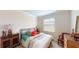 This bedroom showcases a comforting queen-size bed, accompanied by elegant wooden furniture and calming decor at 15644 Aurora Lake Cir, Wimauma, FL 33598