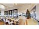 A spacious dining area in a community clubhouse with a Christmas tree and wooden floors at 15644 Aurora Lake Cir, Wimauma, FL 33598