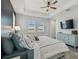Inviting main bedroom boasts lots of natural light, ensuite bath, and ceiling fan for maximum comfort at 17441 Savory Mist Cir, Bradenton, FL 34211