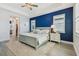 Spacious main bedroom features a bold accent wall, plantation shutters, and an ensuite bathroom at 17441 Savory Mist Cir, Bradenton, FL 34211