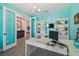 Well-lit office with built-in bookcases, a modern desk, and stylish decor at 17441 Savory Mist Cir, Bradenton, FL 34211