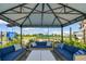 Relax in style with plush outdoor seating, offering views of the community playground and basketball court at 17441 Savory Mist Cir, Bradenton, FL 34211