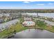 Aerial view features a community pool, waterways, and well-maintained landscaping at 209 Seahorse Se Dr # D, St Petersburg, FL 33705