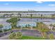 Aerial shot features waterfront condos, palm trees, and a stunning lake view at 209 Seahorse Se Dr # D, St Petersburg, FL 33705