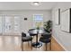 Cozy dining space featuring table set with modern accents, natural light, and hardwood floors at 209 Seahorse Se Dr # D, St Petersburg, FL 33705