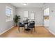 Dining room with modern table set, natural lighting, and hardwood floors at 209 Seahorse Se Dr # D, St Petersburg, FL 33705