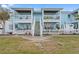 Charming two-story exterior view with inviting patios and well-maintained landscaping at 209 Seahorse Se Dr # D, St Petersburg, FL 33705