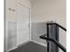Apartment door featuring neutral paint, and a black railing on a staircase at 209 Seahorse Se Dr # D, St Petersburg, FL 33705