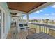 Relaxing patio with outdoor dining and tranquil lake views at 209 Seahorse Se Dr # D, St Petersburg, FL 33705