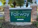 Fairway Estates sign welcomes you to a community with well maintained landscaping at 2324 Middlecoff Dr, Dunedin, FL 34698