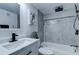 Modern bathroom featuring a bathtub, gray tile shower and black fixtures at 2500 Harn Blvd # F22, Clearwater, FL 33764