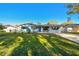 Inviting single-story home with light-blue exterior, dark-blue shutters, and a well-maintained front yard at 2833 56Th N Ln, St Petersburg, FL 33710